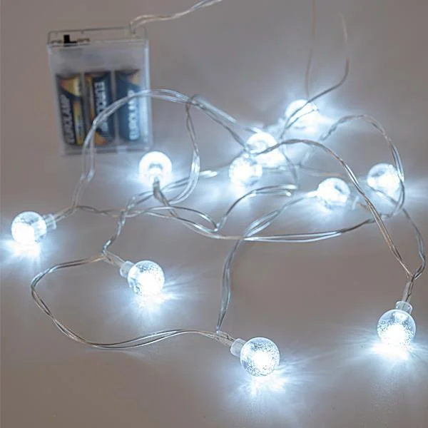Φωτογραφία προϊόντος: ΣΕΙΡΑ, 10 LED 5MM, ΜΕ ΑΚΡΥΛΙΚΕΣ ΔΙΑΦΑΝΕΣ ΜΠΑΛΕΣ 1,8CM, ΜΠΑΤΑΡΙΑΣ, ΔΙΑΦΑΝΟ ΚΑΛΩΔΙΟ, ΘΕΡΜΟ ΛΕΥΚΟ LED, ΑΝΑ 15CM, ΠΡΟΕΚΤΑΣΗ ΠΑΡΟΧΗΣ 50CM, IP20 (600-11248)