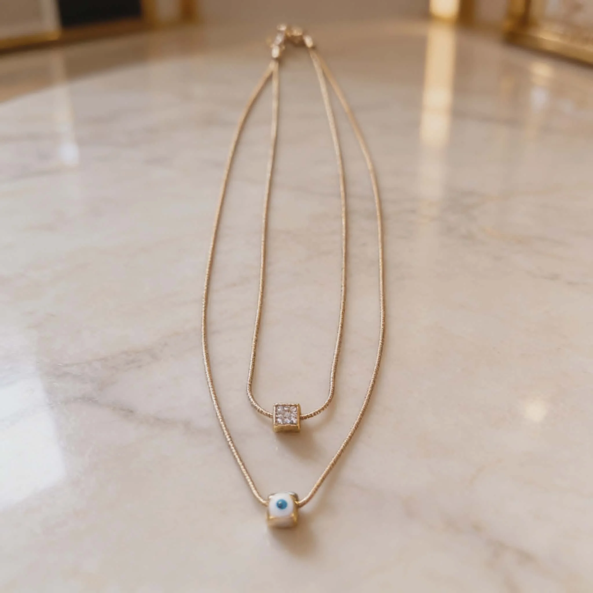 Φωτογραφία προϊόντος: LAVORE Double Layer Necklace with Evil Eye & Crystal Pendant Gold Stainless Steel