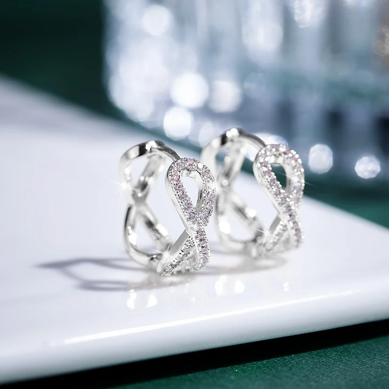 Φωτογραφία προϊόντος: Peach Jewelry Σκουλαρίκια Κρικάκι Άπειρο Με Λευκά Ζιρκόν Ασήμι 925 Symbol